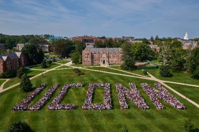 Aerial view of the Great Lawn at UConn with a large crowd standing so as to form the word 